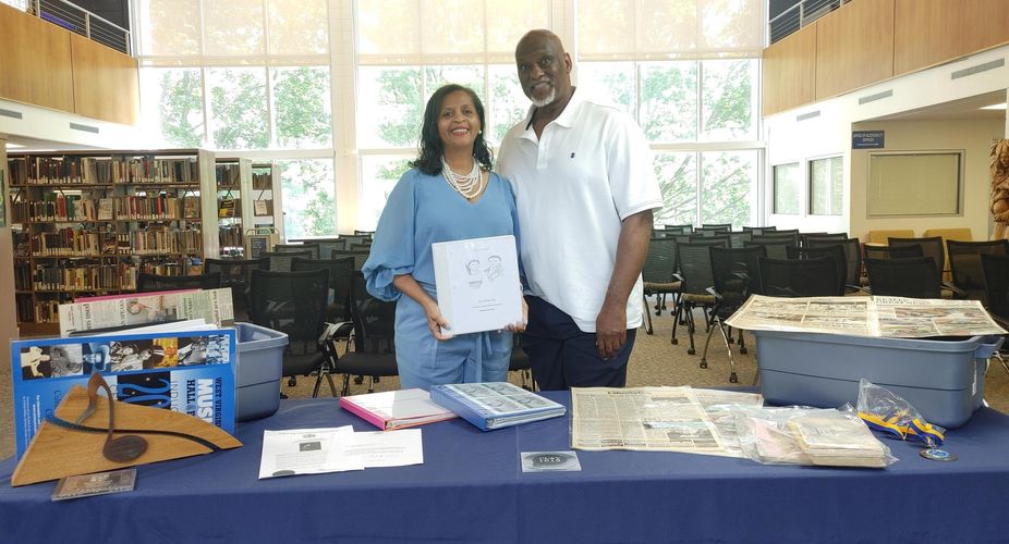 Leontyne ‘Gaye’ Clay Peck and her husband, Lyle, display a few of the items they recently donated to the Mary F. Shipper Library.
